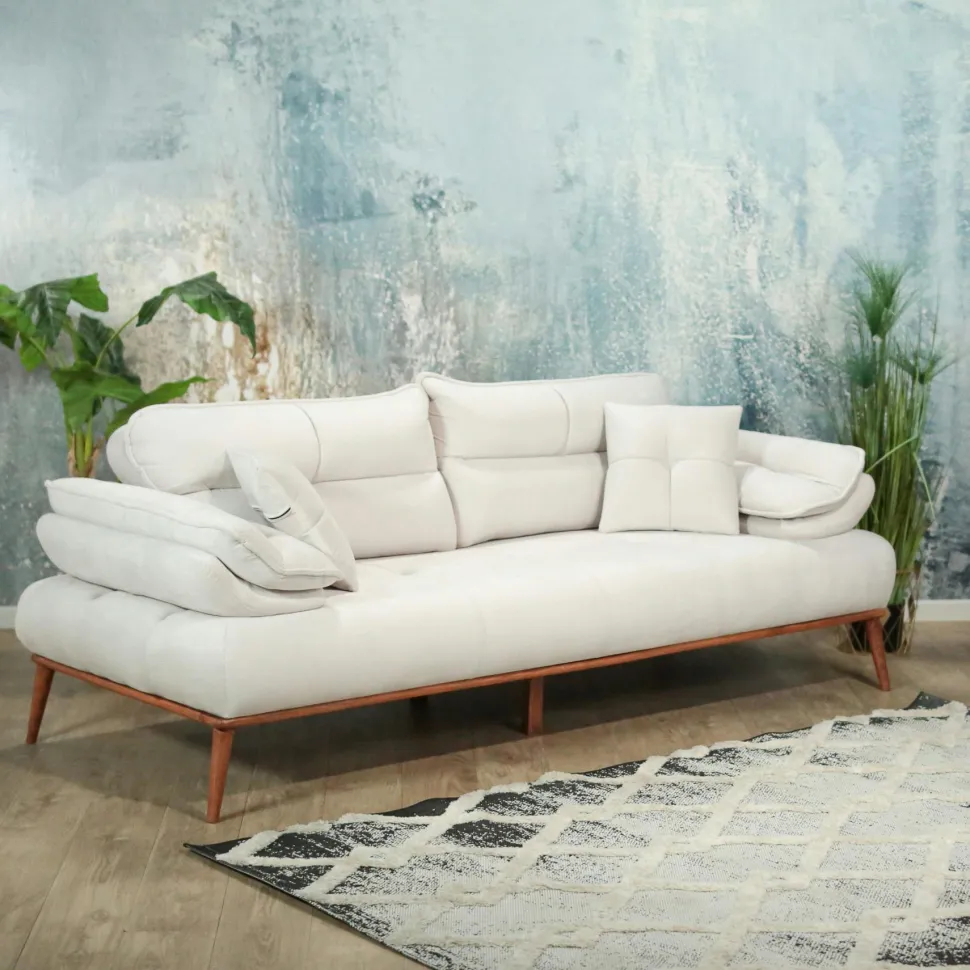Fauteuil chauffeuse tissu capitonné beige avec coussin