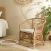 Fauteuil en rotin chic avec coussin blanc MANY