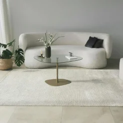 Table basse verre minimaliste forme galet et pied doré TULUM
