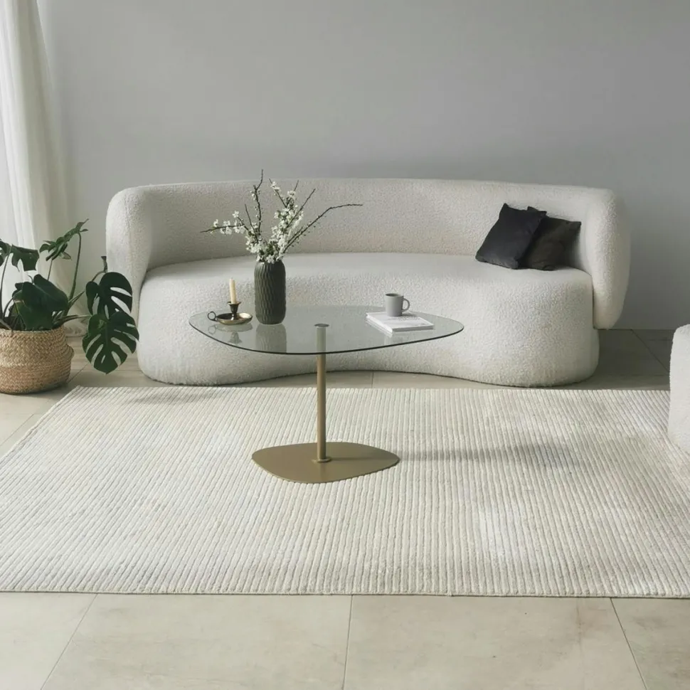 Table basse verre minimaliste forme galet et pied doré TULUM